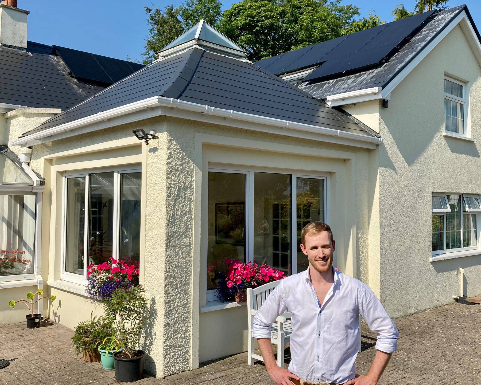 AirPV founder with rooftop solar installation